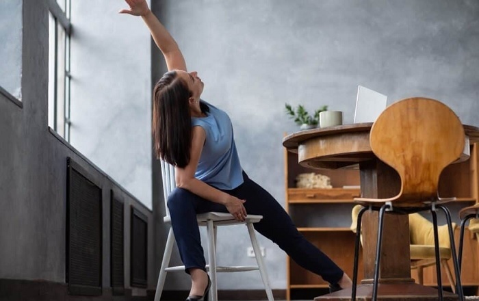 8 Yoga Poses You Can Do in Your Desk Chair